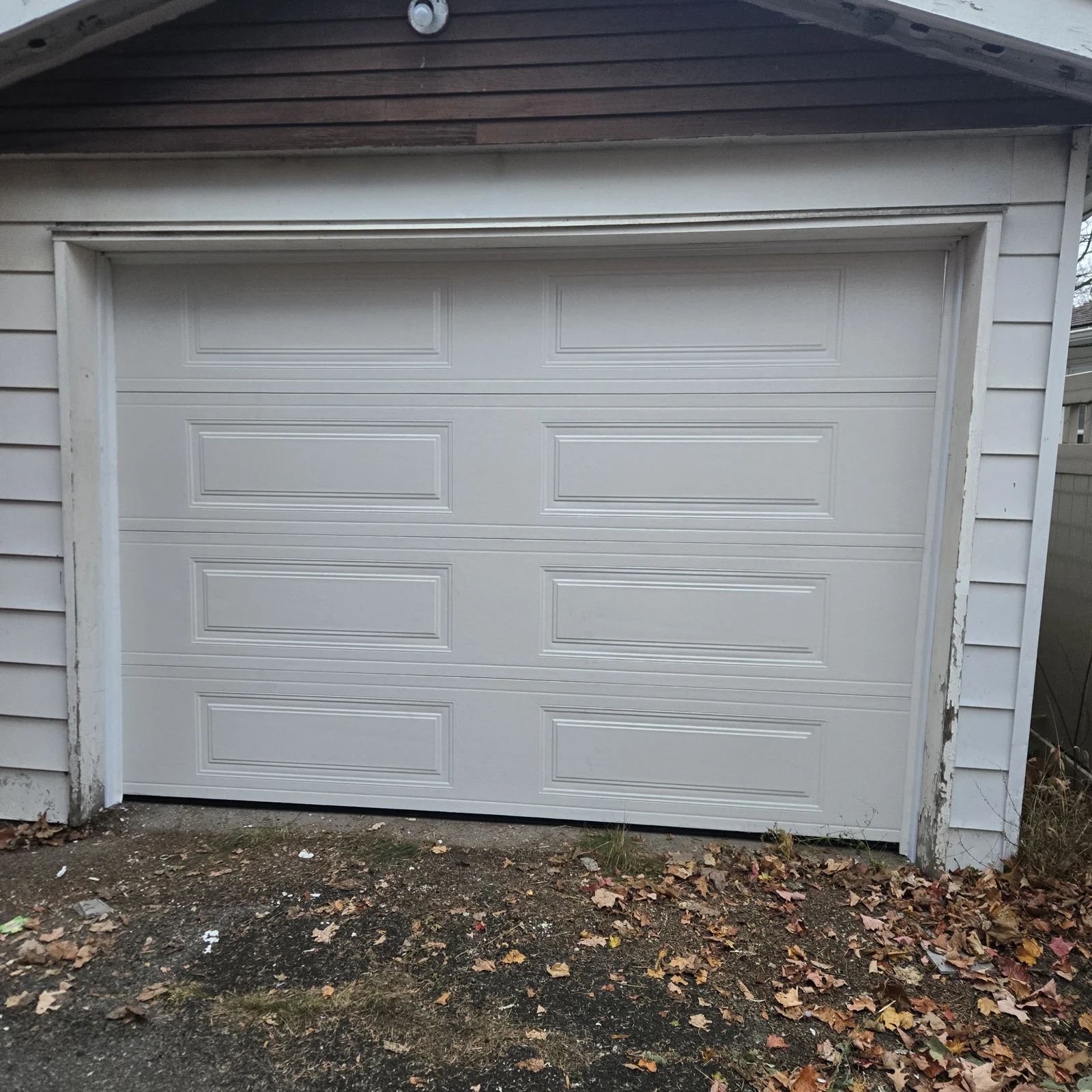After: Heritage 500 long-panel replacement door at a detached garage.