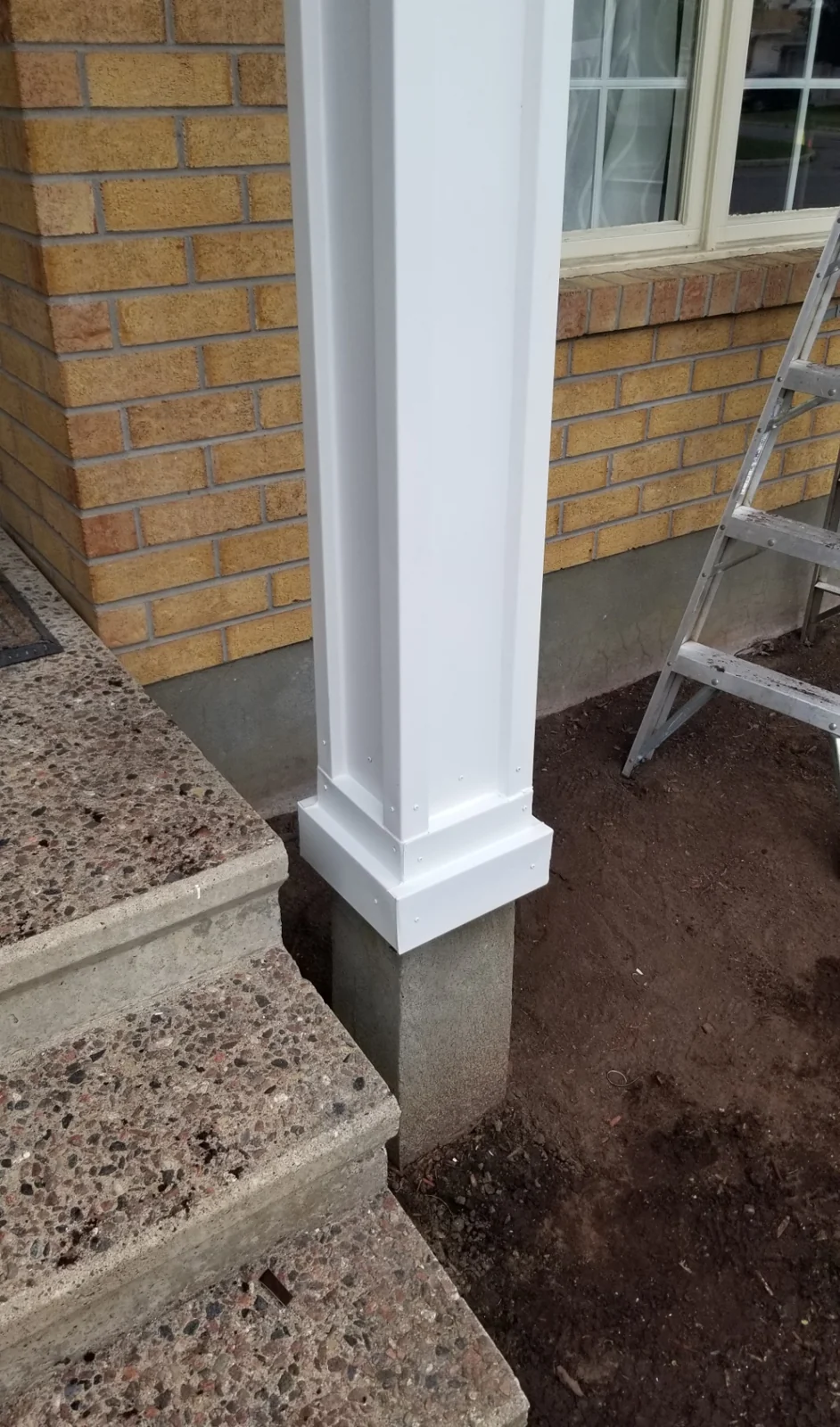 After: White column capping and finished base trim.