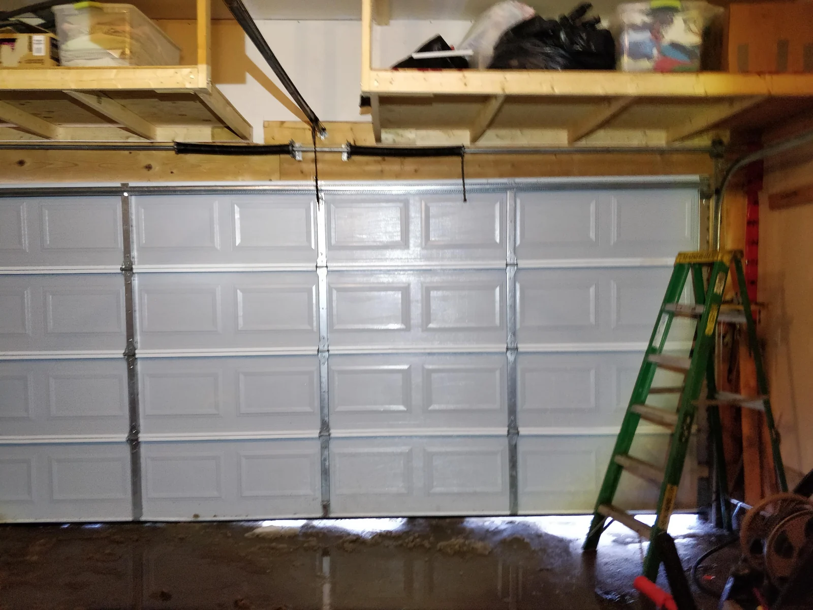The same sectional garage door straight and closed after realignment.